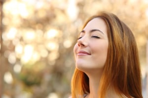 woman enjoying the benefits of chiropractic care with easier breathing
