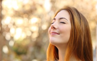 woman enjoying the benefits of chiropractic care with easier breathing
