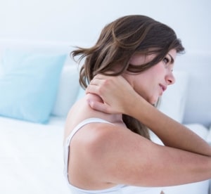 image of a women experiencing neck pain