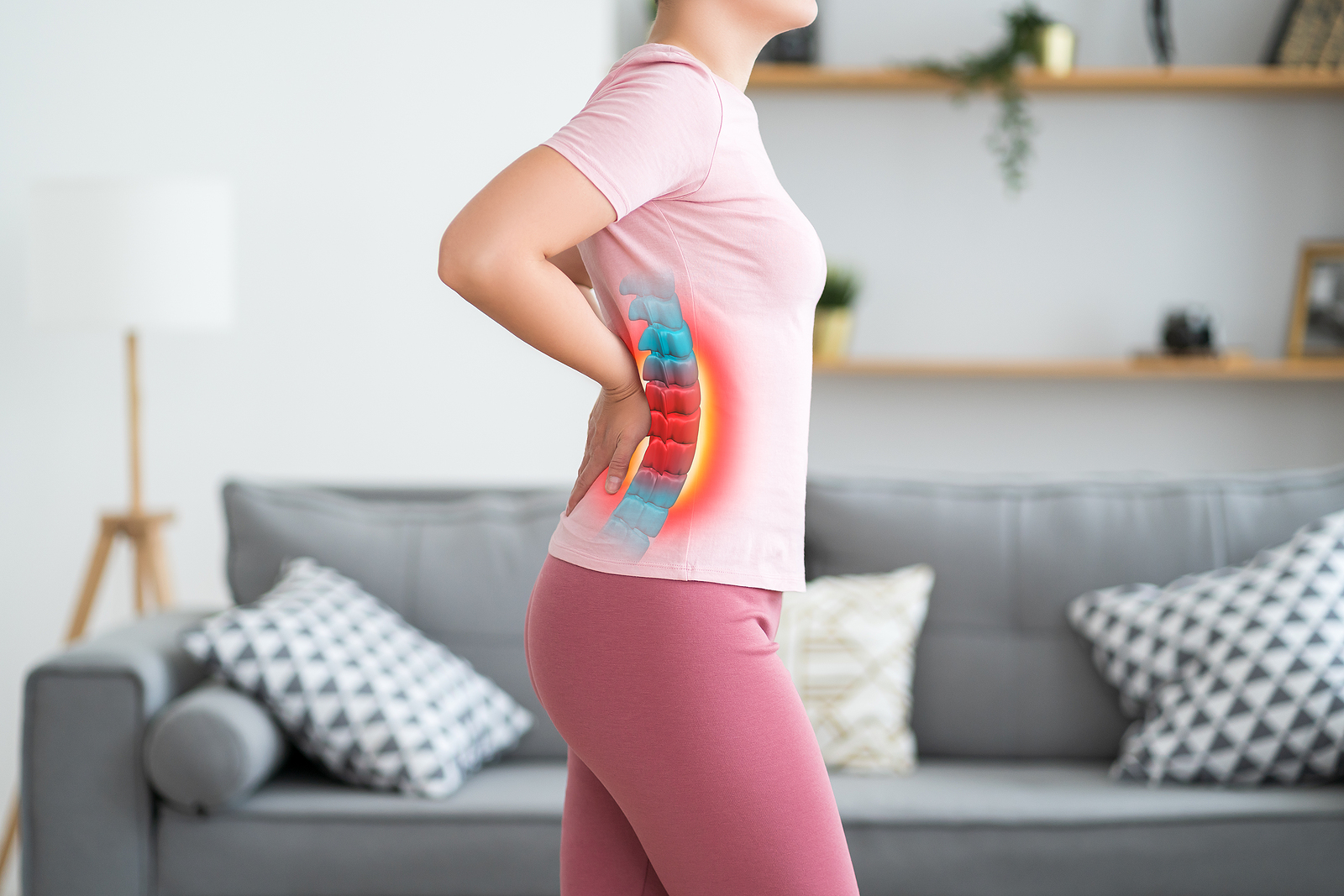woman in pink with spinal pain